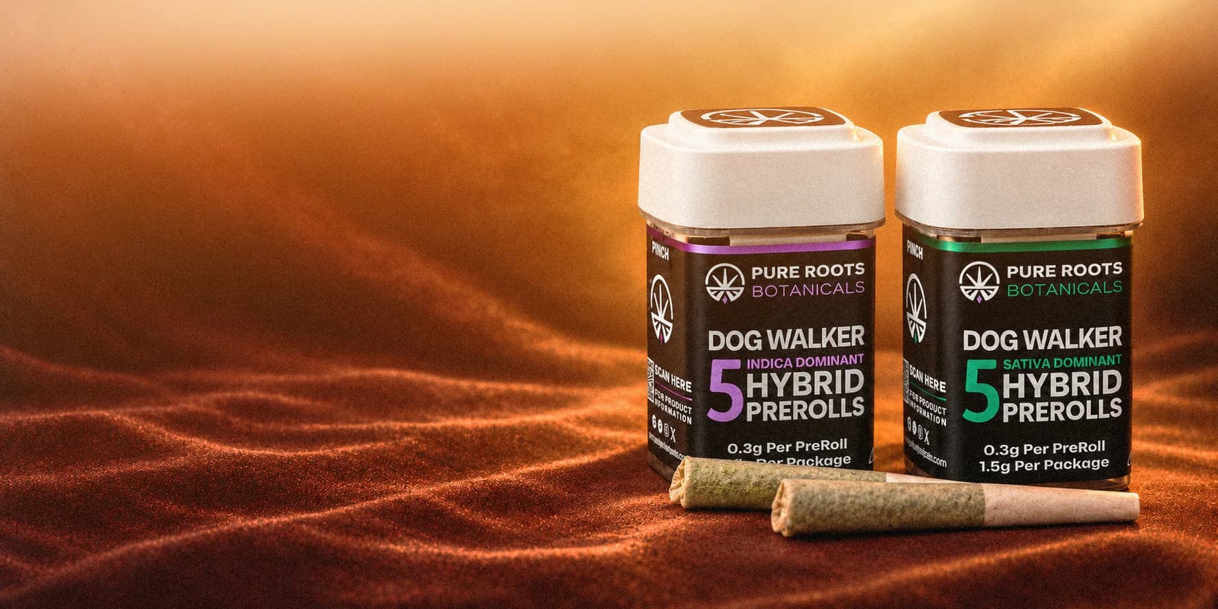 Dog Walker indica and sativa pre-roll jars with two pre-rolls on orange velvet