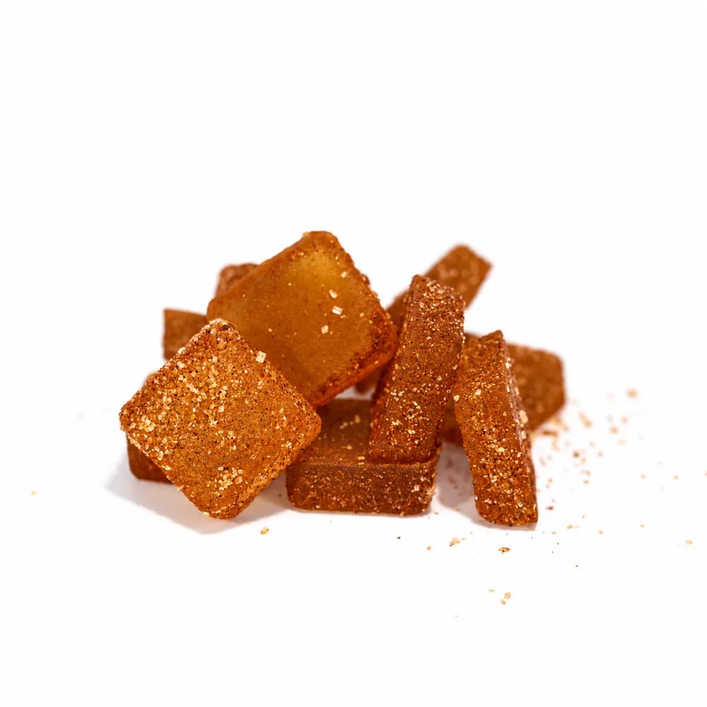 Close-up of sugar-coated Pumpkin Spice live rosin Delta-9 gummy squares