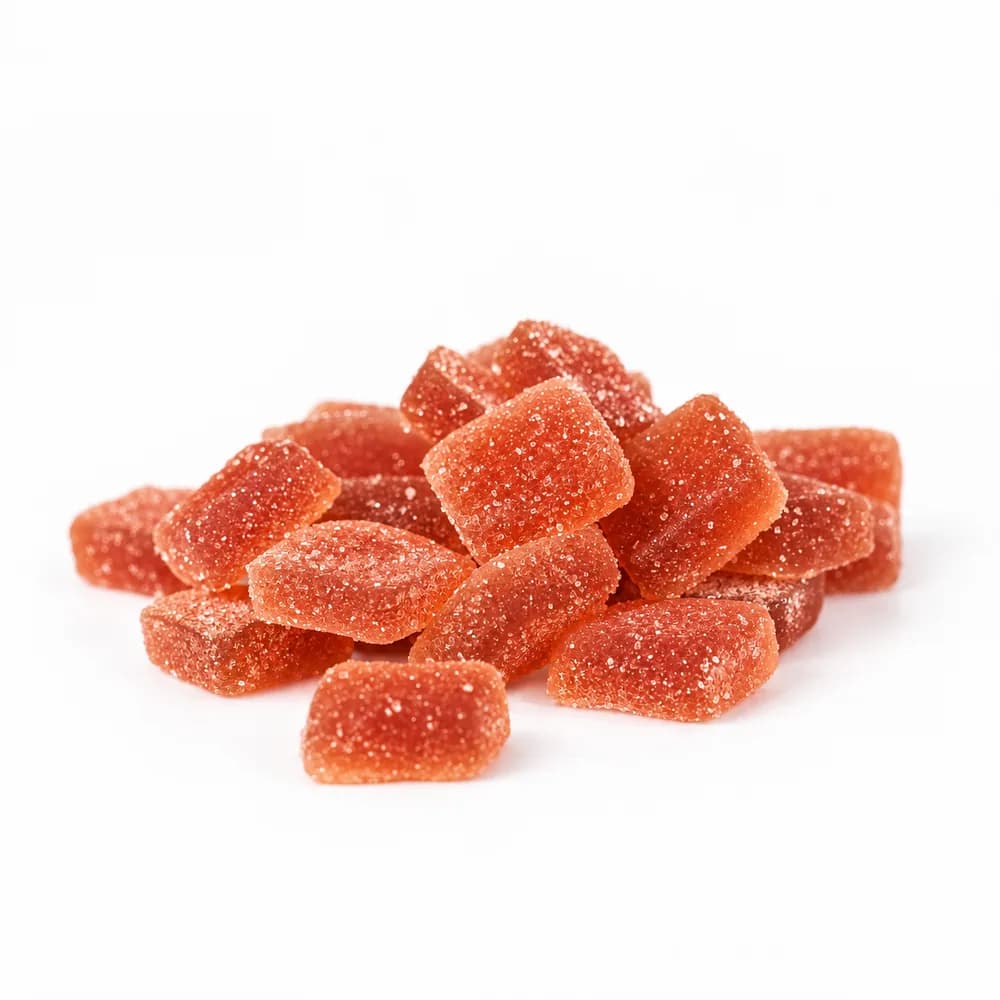 Close-up of sugar-coated Watermelon Delta-9 gummy squares