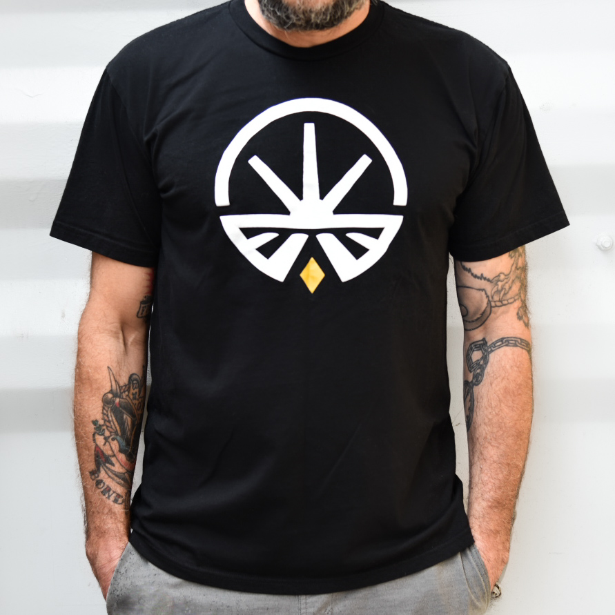 Pure Roots Botanicals black logo t-shirt — the free member tee included with the Insiders Club.
